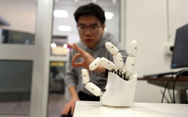 Wristband enables wearers to control a robotic hand with their own movements